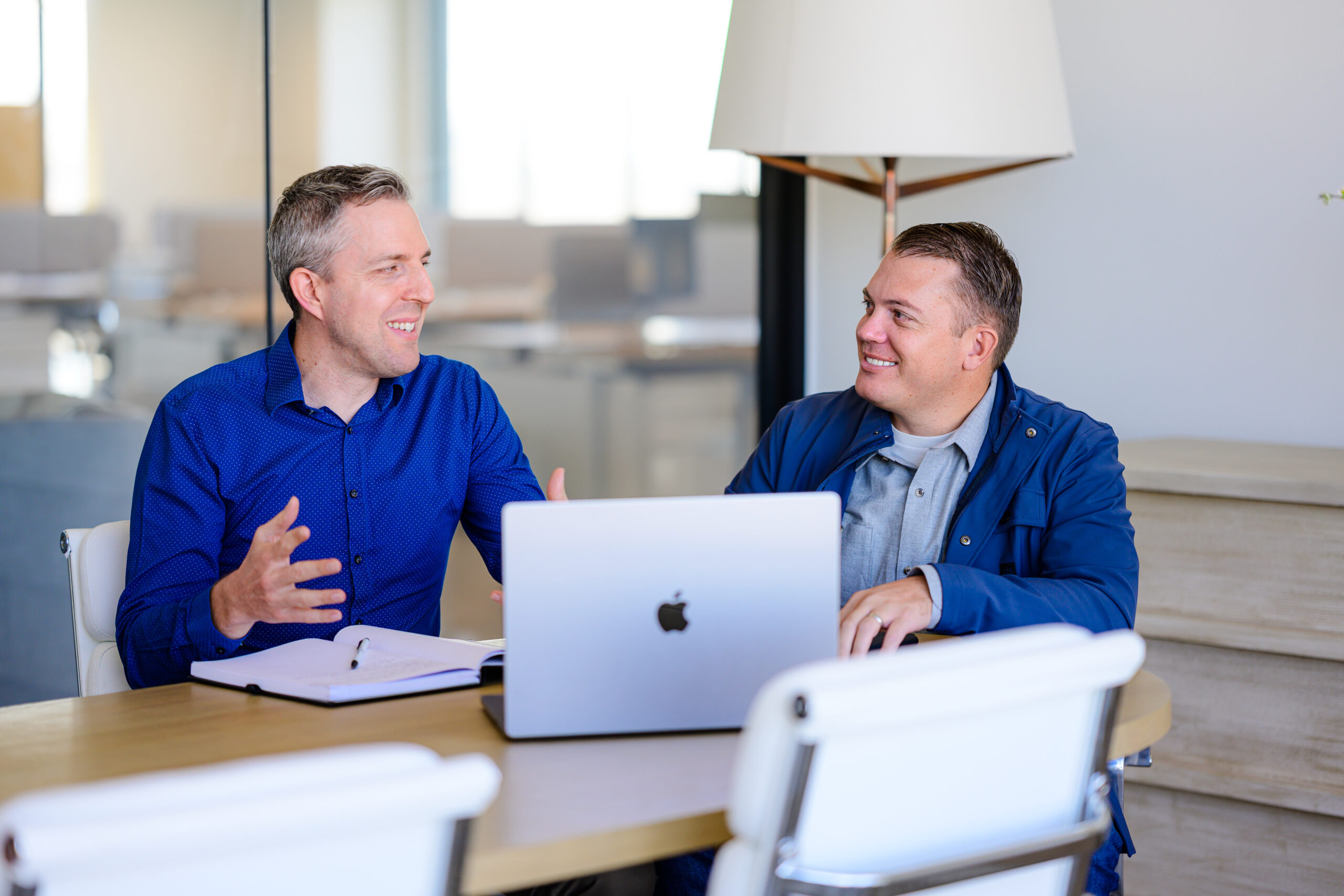 Founder Shane Rowley and Tax lead Shawn Bean go over tax strategy in an office.